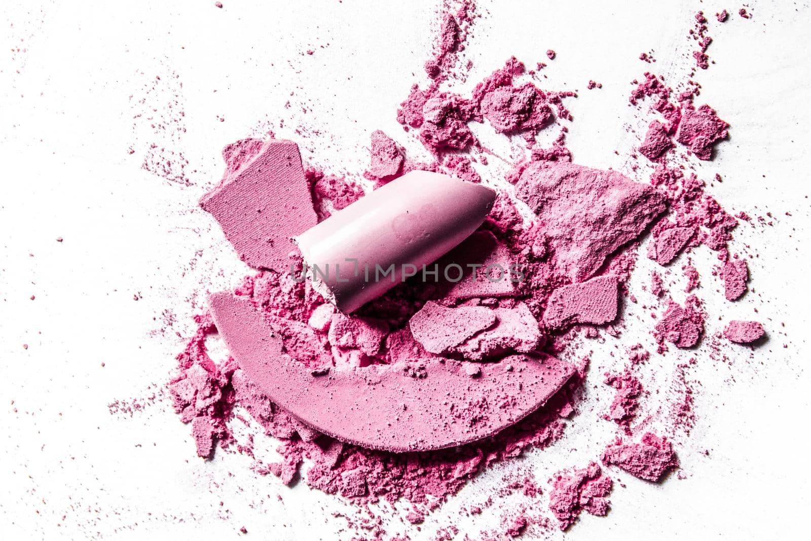 Beauty texture, cosmetic product and art of make-up concept - Crushed eyeshadows, lipstick and powder isolated on white background