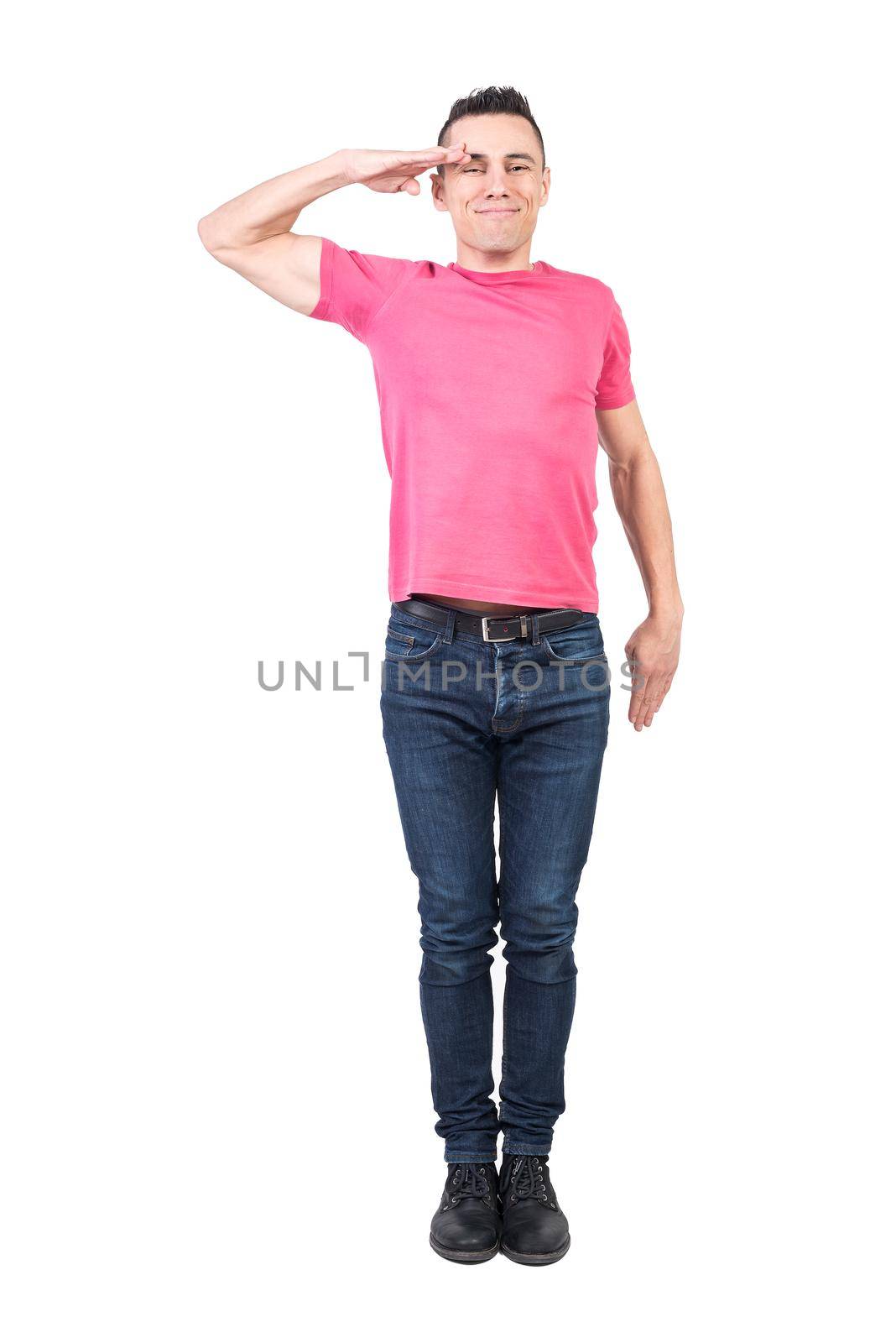 Full body of cheerful male soldier looking at camera and making salute gesture while standing isolated on white background in studio