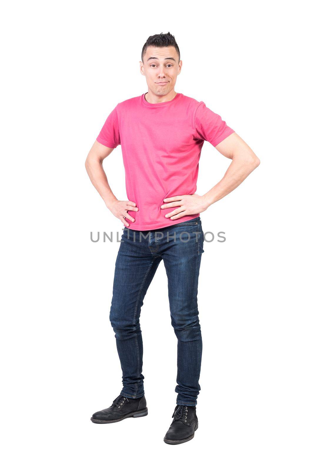 Full body of self confident male model smirking and looking at camera with hand son waist isolated on white background