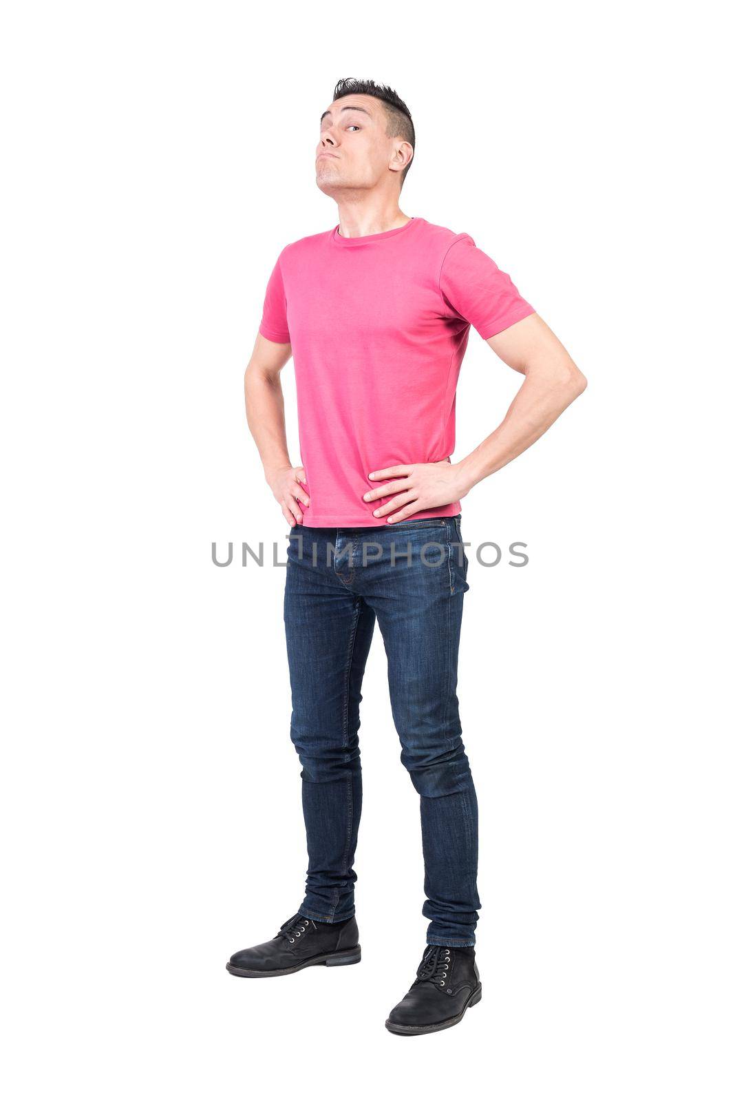 Full body of male guard looking at camera with serious face while standing with hands on waist isolated on white background