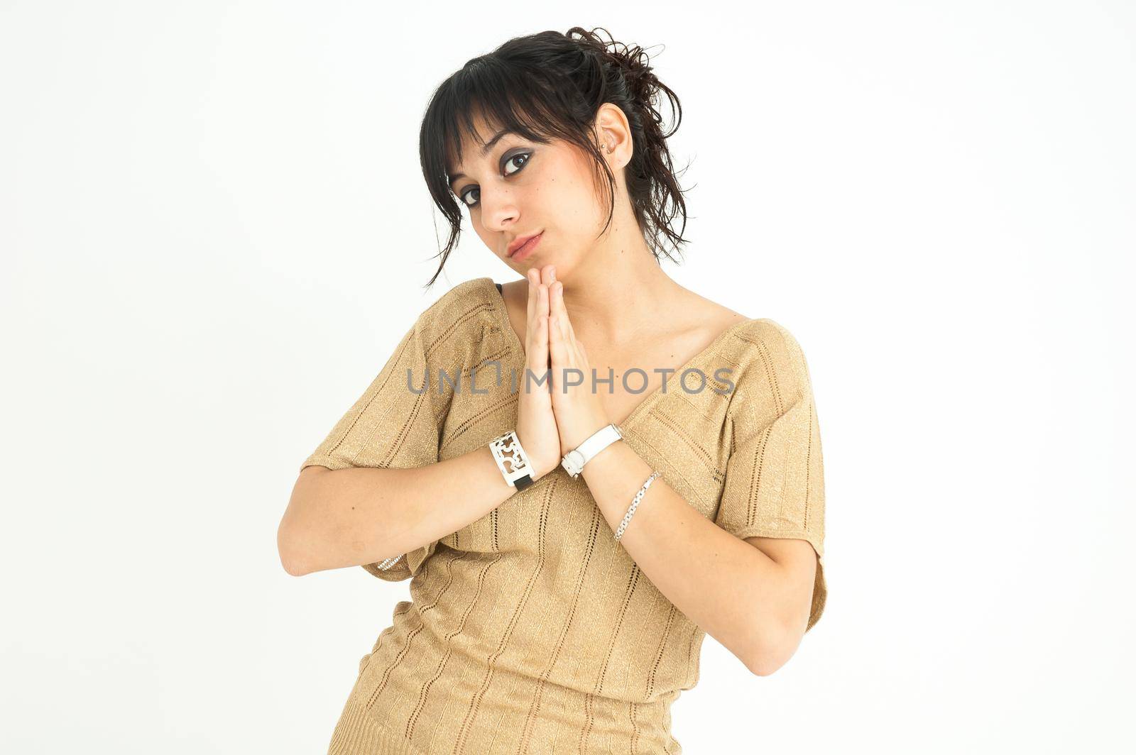pretty girl with joined hands like a good and formal girl, with collected hair, on white background, medium shot