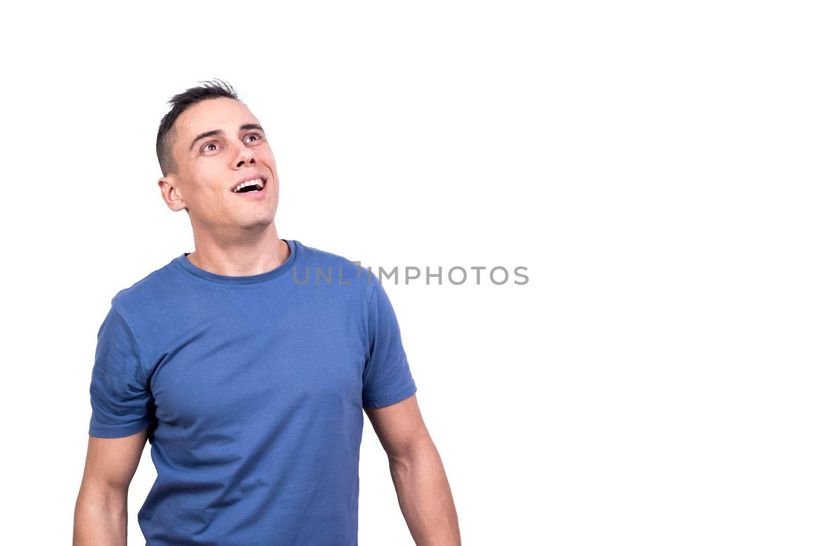 Studio portrait with white background of a man looking up with happy expression