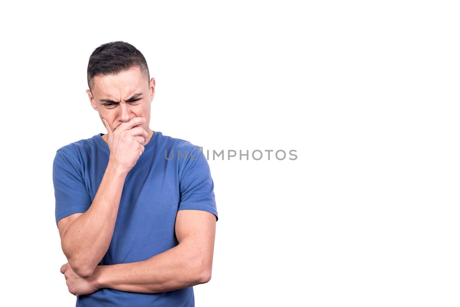 Studio shot of a man with his hand on his face thinking seriously in a white background