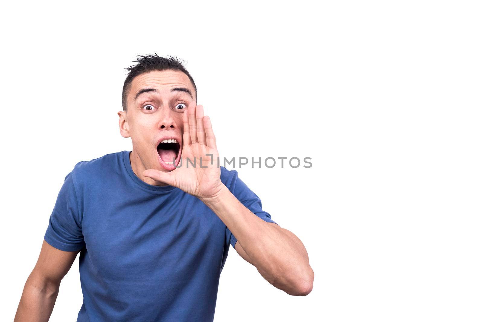 Studio photo with white background of a man with hand next to mouth screaming