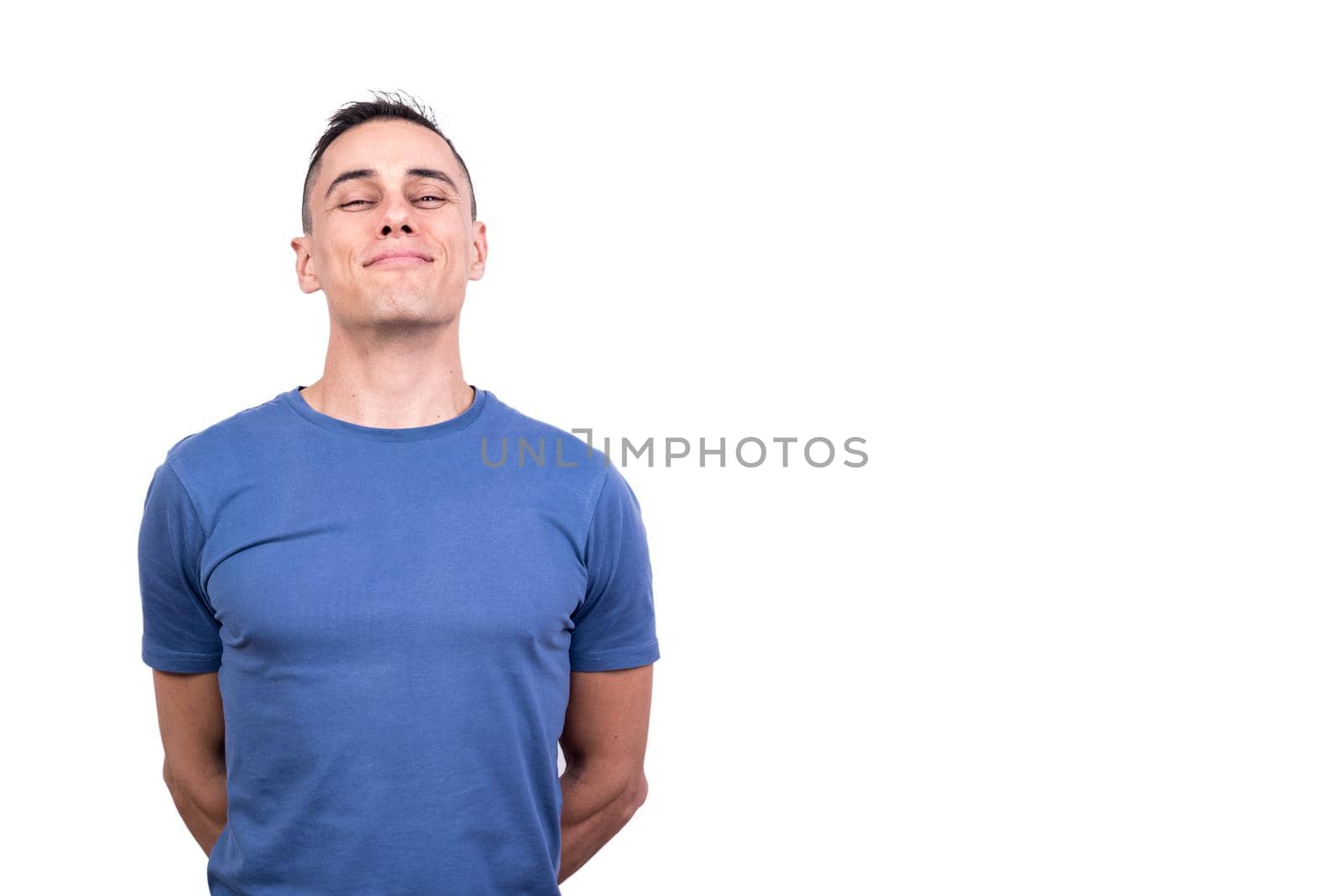 Studio portrait with white background of a proud man with smile in his face