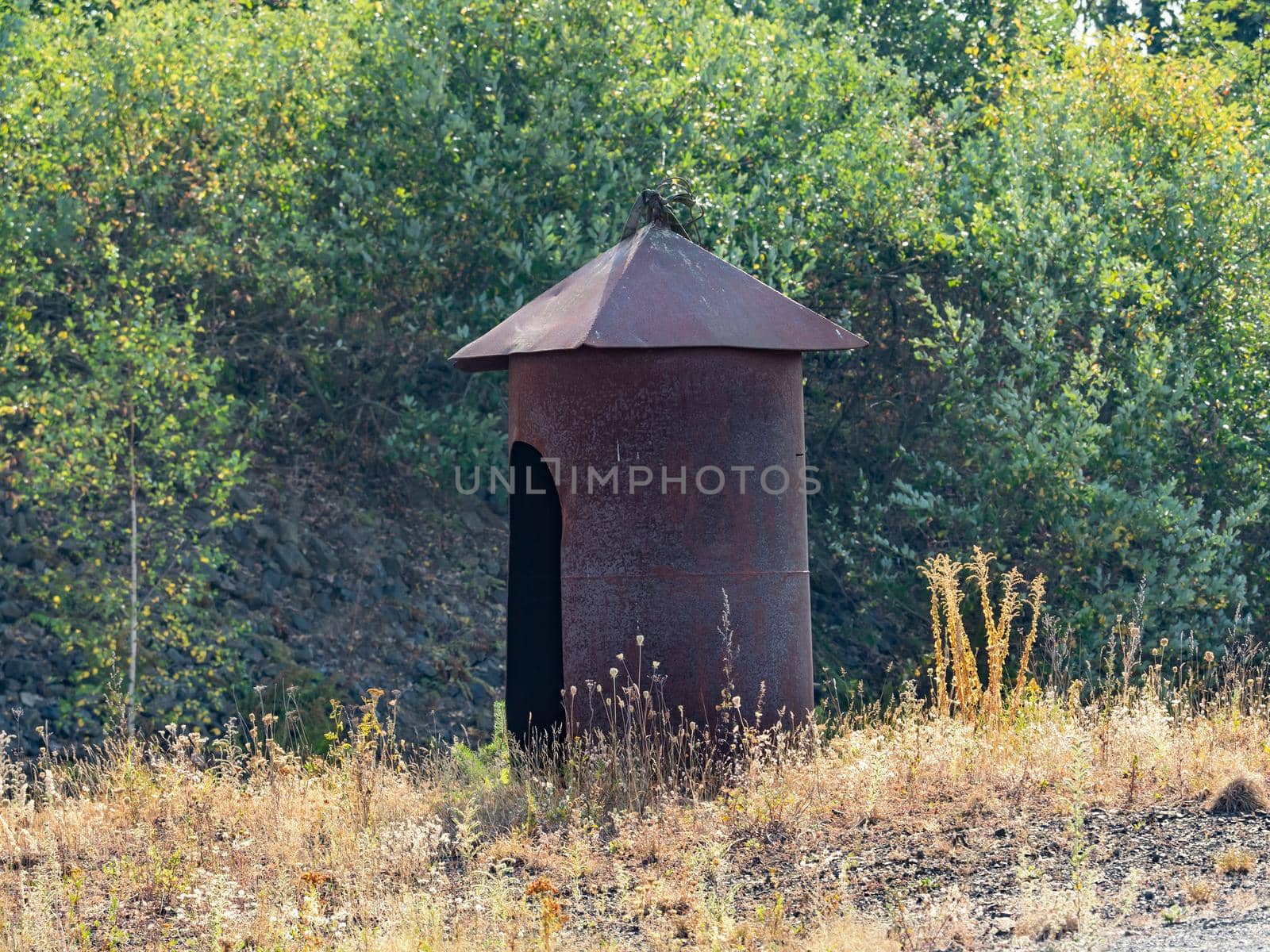 Rusty shelter protecting demolition man during dynamite explosion  by rdonar2