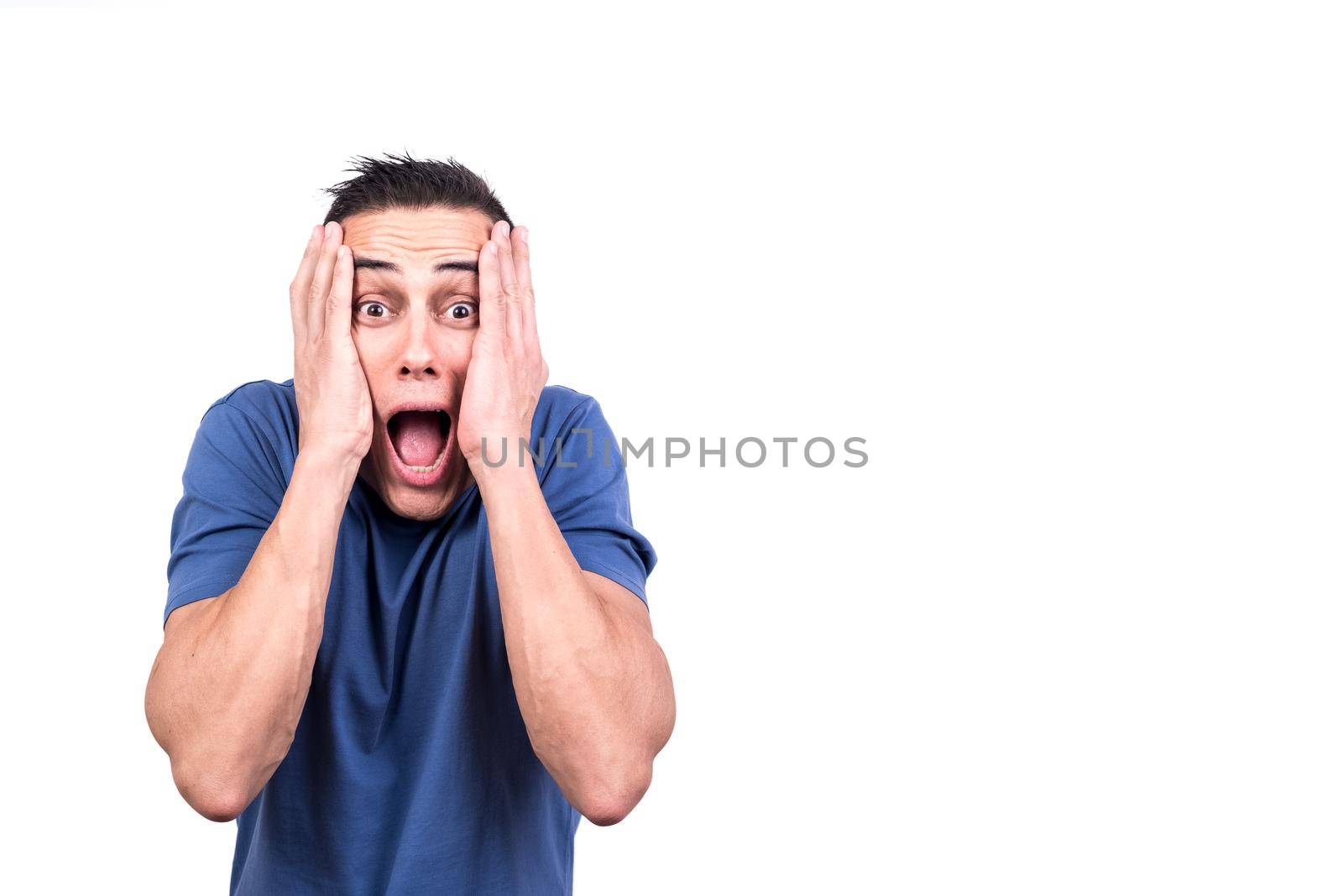 Studio photo with white background of a man with his hands over his face screaming in fear