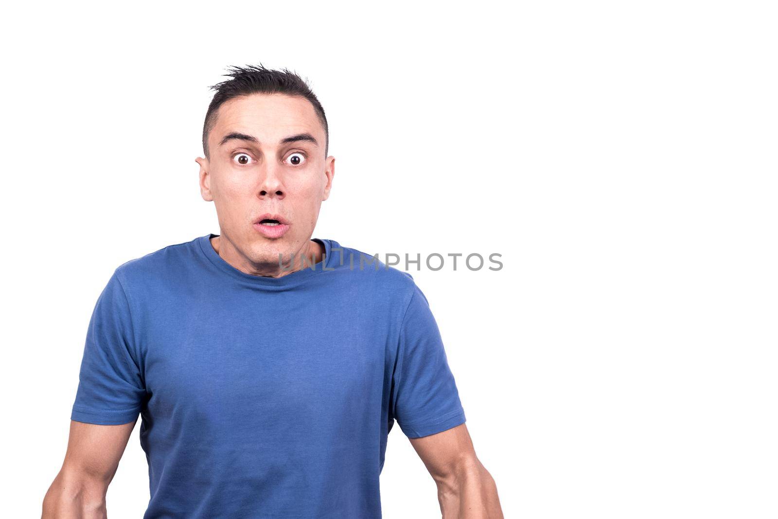 Studio photo with white background of a man with shocked expression looking at the camera