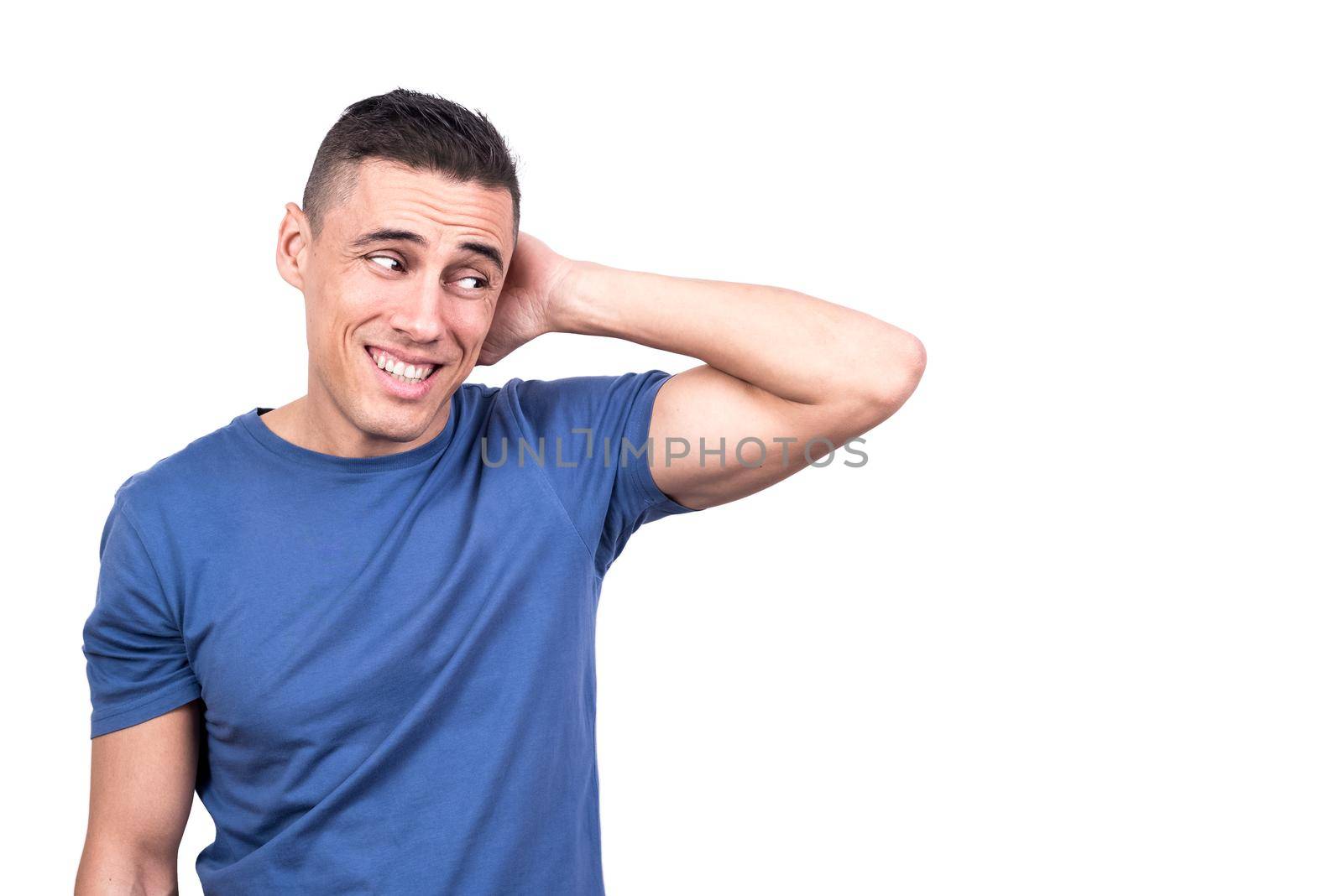 Studio photo with white background of a shy man with his hand on the back of his neck dissimulating