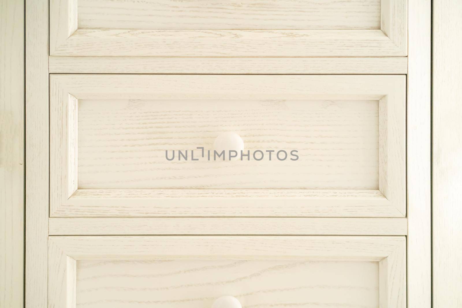 Vintage beautiful restored wooden chest of drawers, painted white, with round door handles. Wardrobe in Provence style.
