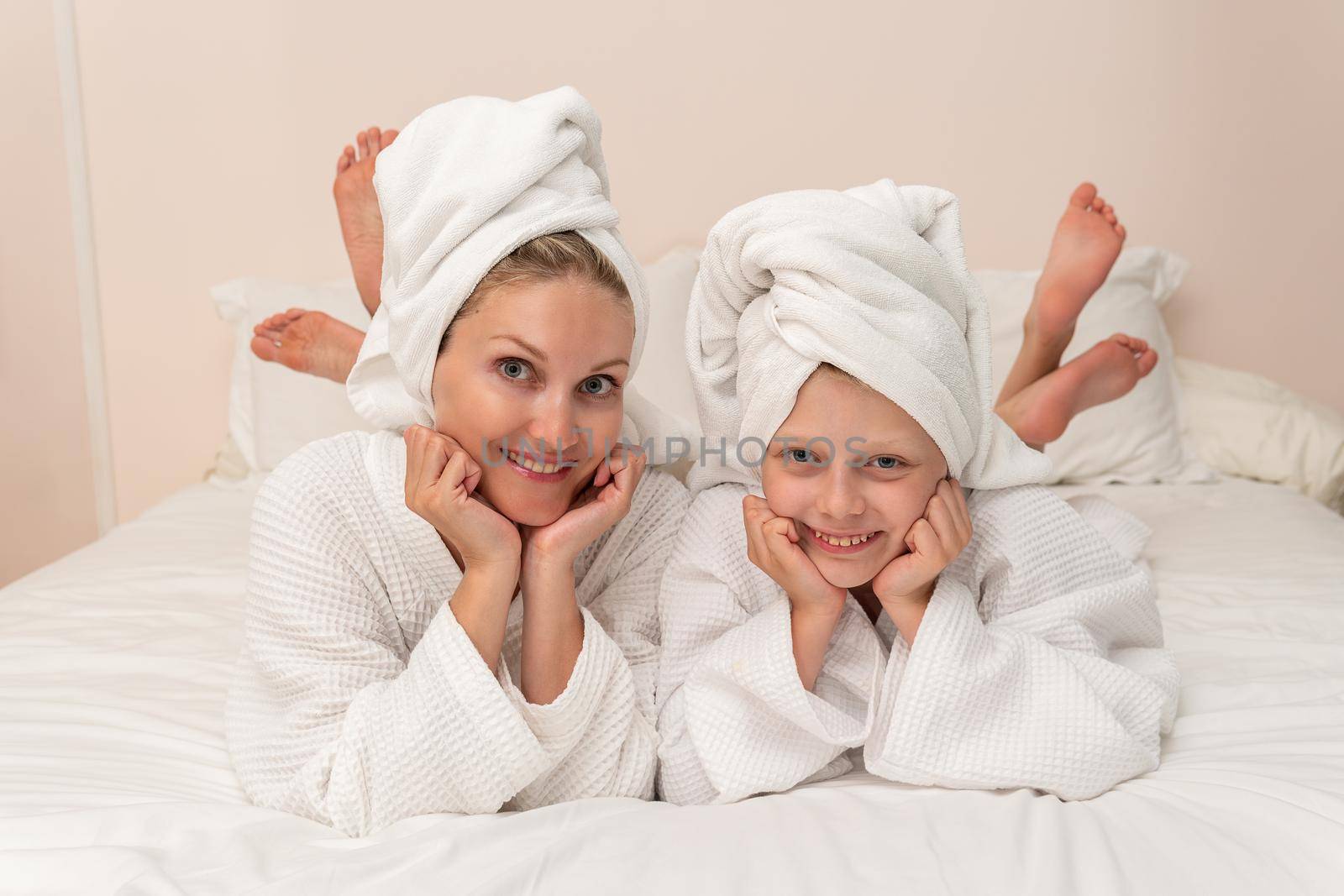 Daughter love mom smiling bath dries thinks elbows Creek bed, from white hygiene from pretty and skin beautiful, child baby. Hair funny comfort,