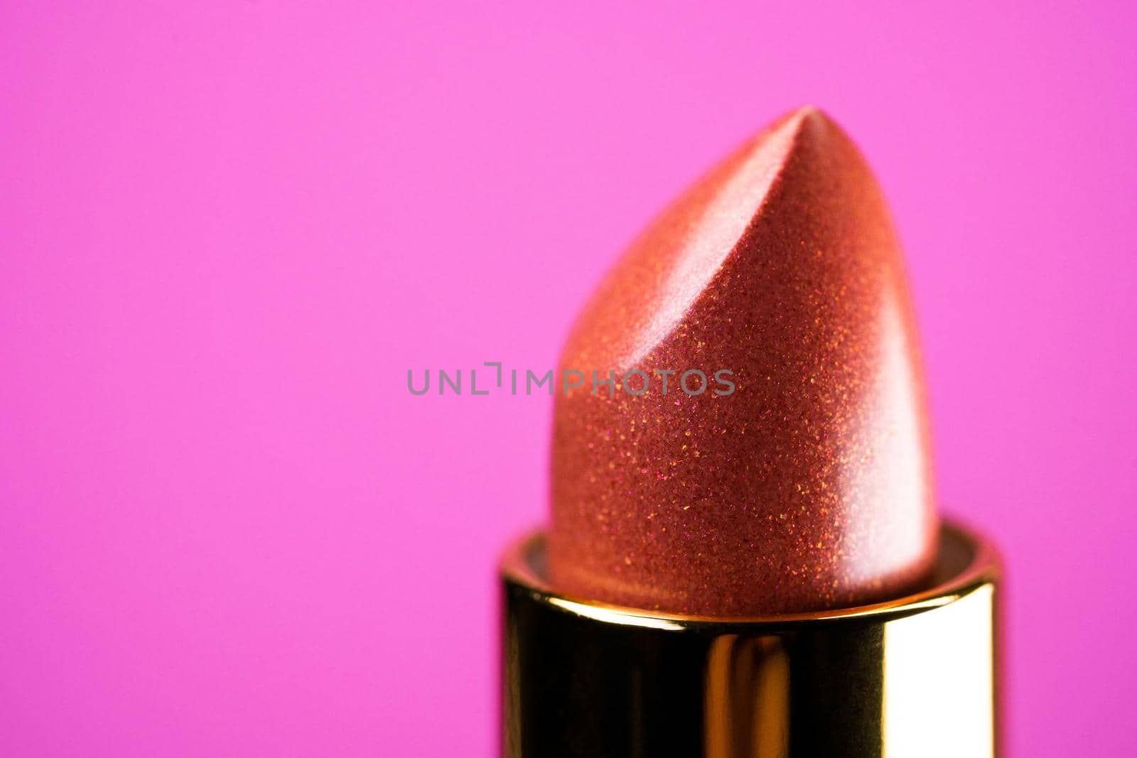 Lipstick on pink background. Showcase or advertisement for beauty brand, Concept of fashion, cosmetics with copy space by kristina_kokhanova