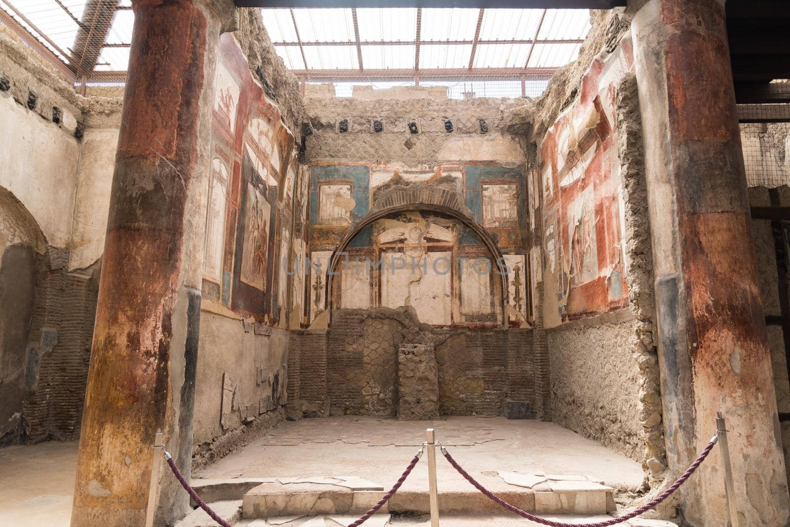 Paintings on the walls at the seat of the Augustan priests at the Roman archaeological site of Herculaneum, Italy.