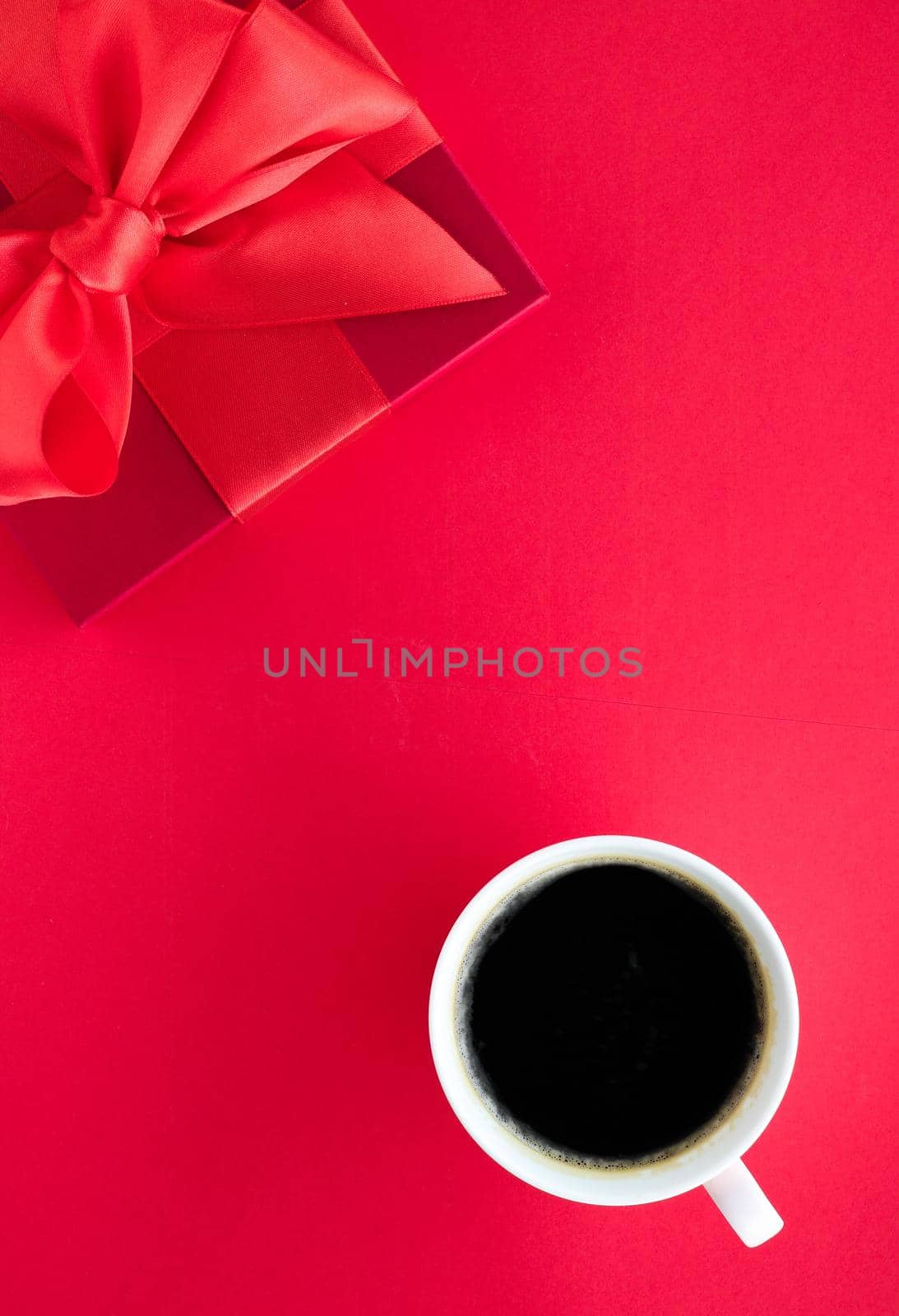 Luxury beauty gift box and coffee on red, flatlay by Anneleven