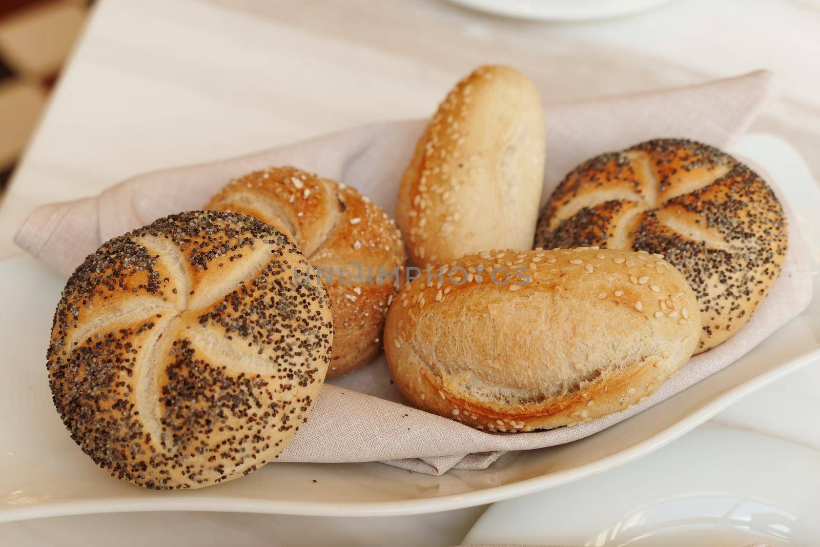 Gluten free pastry, eating out and healthy lifestyle concept - Fresh white bread in a restaurant