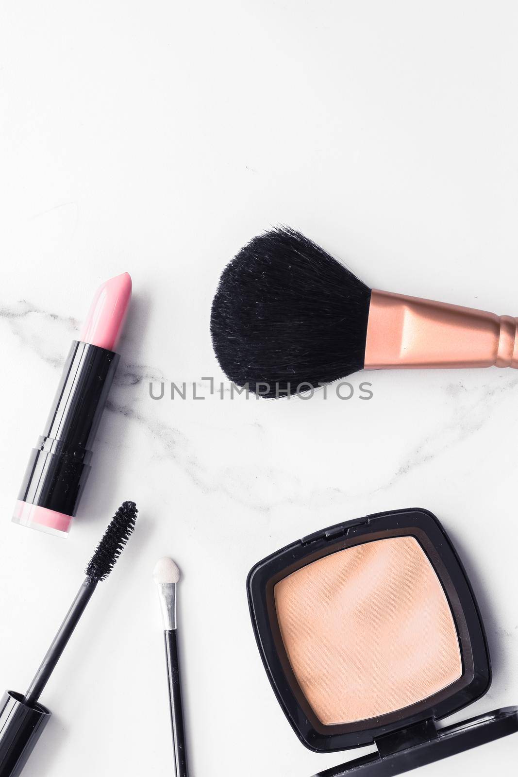 Make-up and cosmetics flatlay on marble by Anneleven