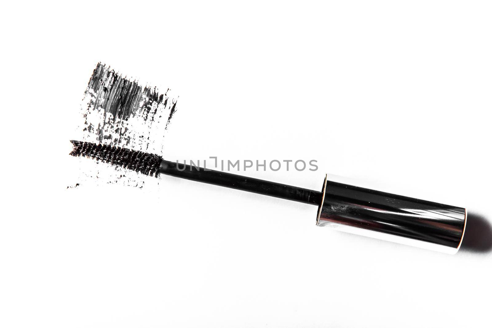 Beauty texture, cosmetic product and art of make-up concept - Black mascara brush stroke close-up isolated on white background