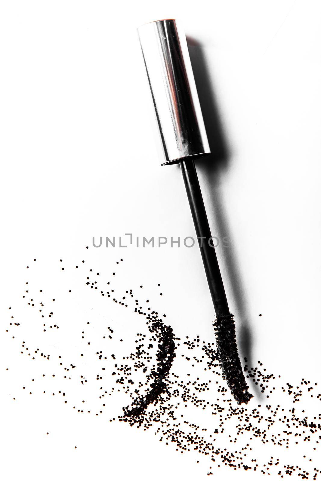 Beauty texture, cosmetic product and art of make-up concept - Black mascara brush stroke close-up isolated on white background