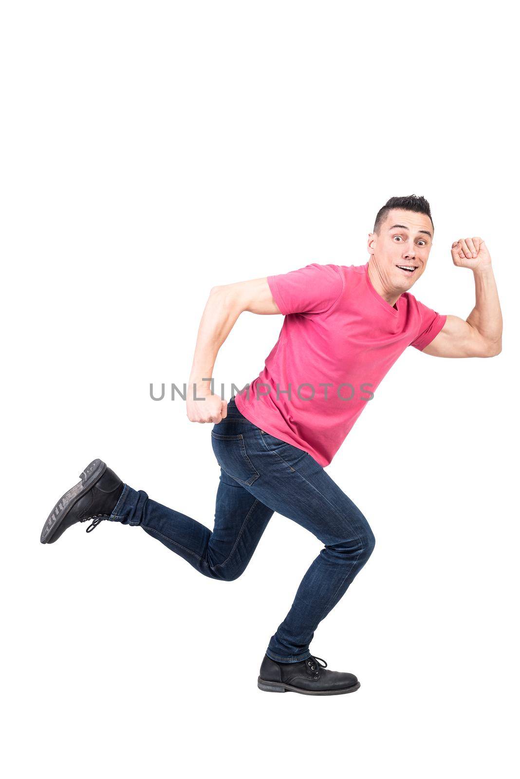 Full body of active male in casual clothes running away and looking at camera on isolated white background in studio