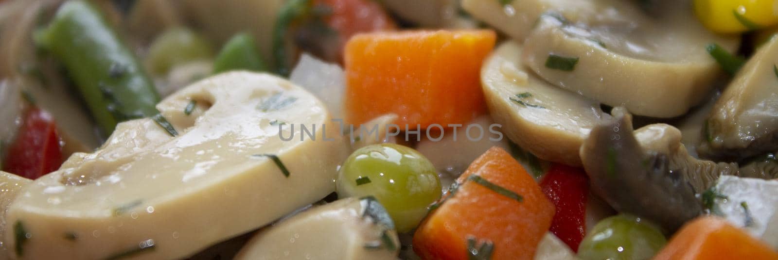 vegetable mixture with stewed mushrooms vegetarian dish with dill with a blurred background on top