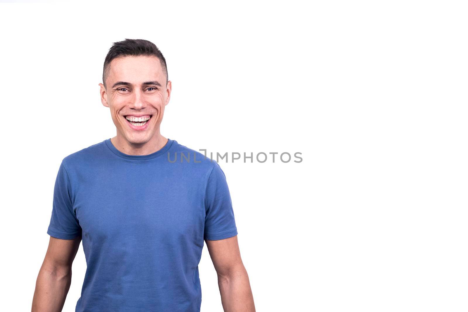 Studio portrait with white background of a man smiling to the camera
