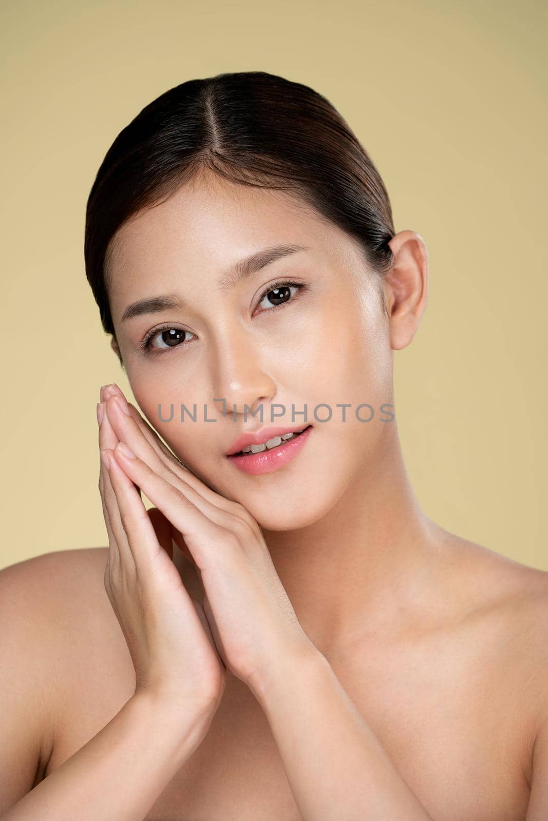 Closeup ardent young woman posing beauty gesture with clean fresh skin. by biancoblue