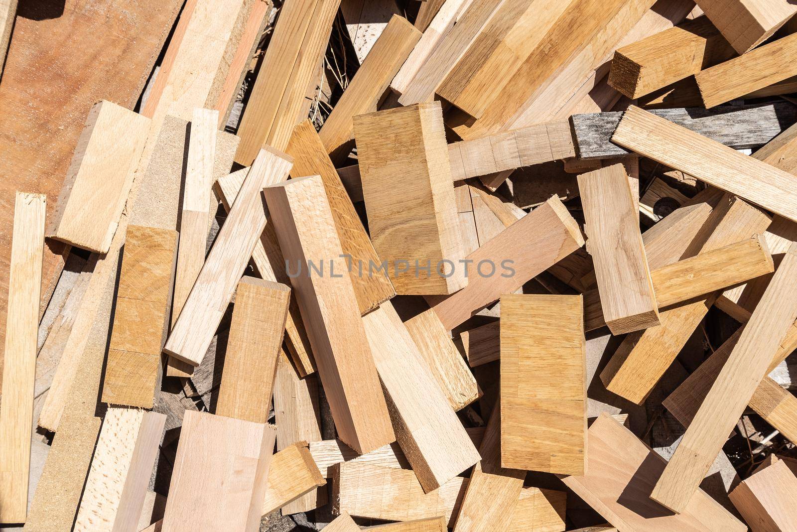 wood scraps of different sizes, colors and shapes, recycling wood