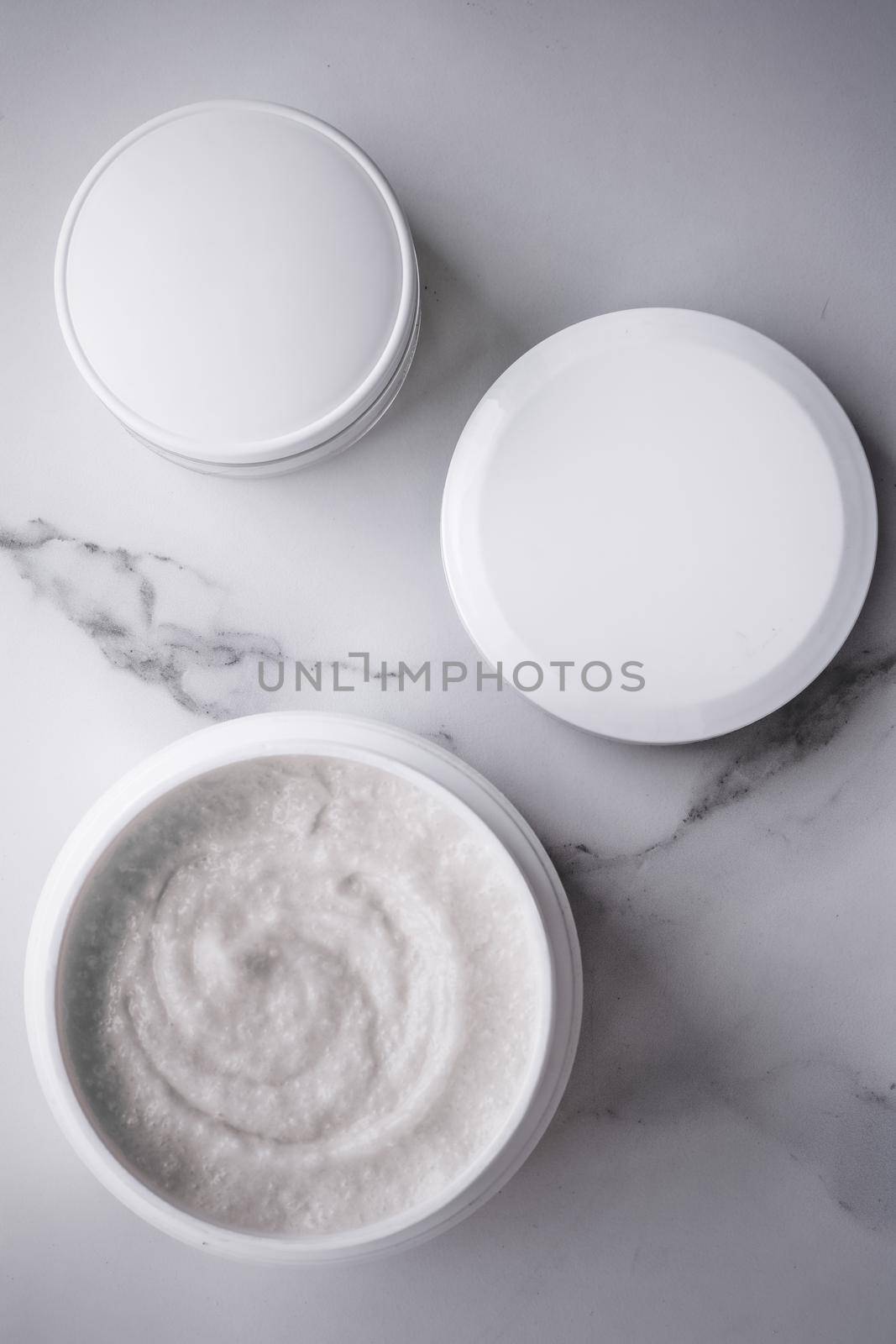 Skincare and body care, luxury spa and clean cosmetic concept. Health and beauty of your skin - Scrub and exfoliating cream products on a marble, flatlay