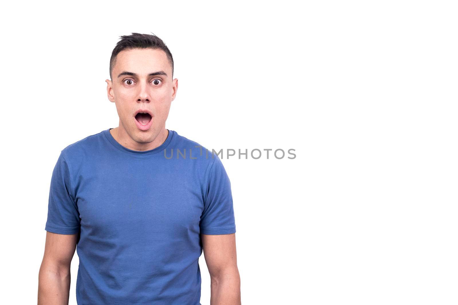 Studio portrait with white background of a man opening the mouth with expression of surprise
