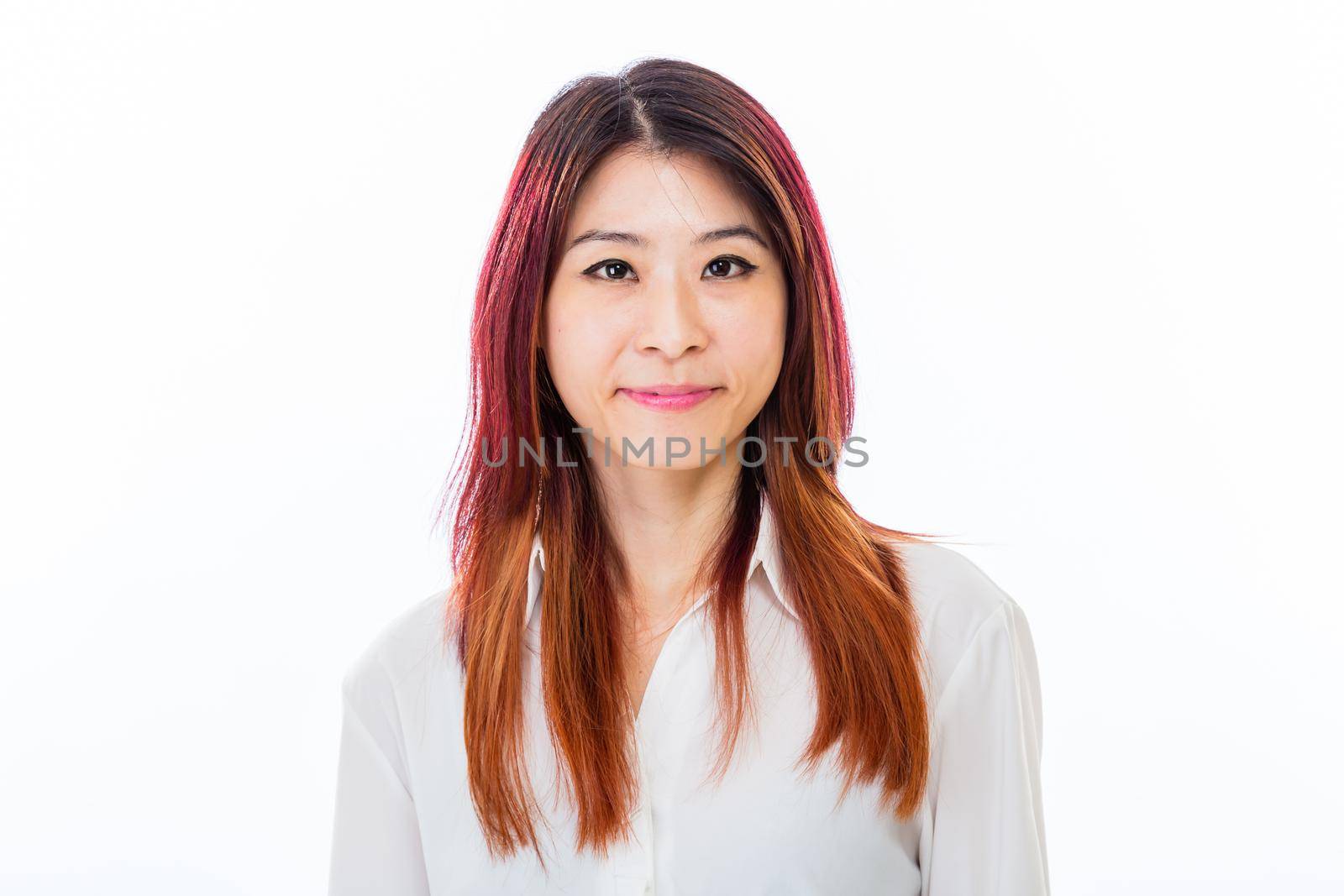 Asian Chinese businesswoman in casual business clothing smiling at camera