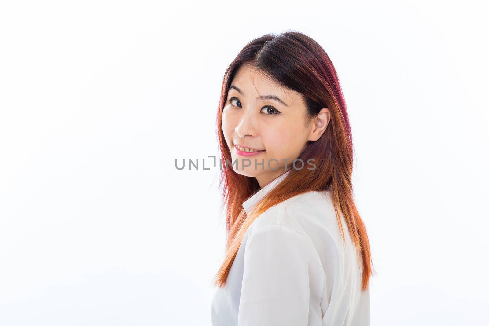 Asian Chinese businesswoman in casual business clothing smiling at camera