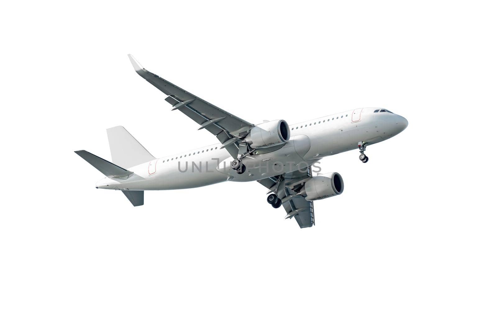 Commercial airplane flying high in white background