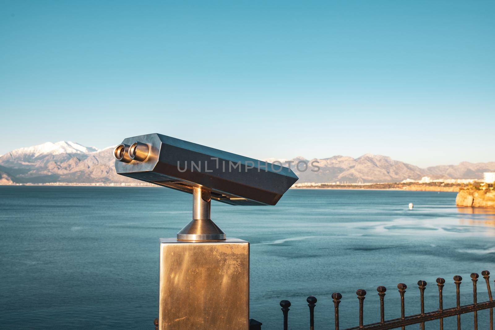stationary observation binoculars at sunrise on a sunny winter day in Antalya Turkey