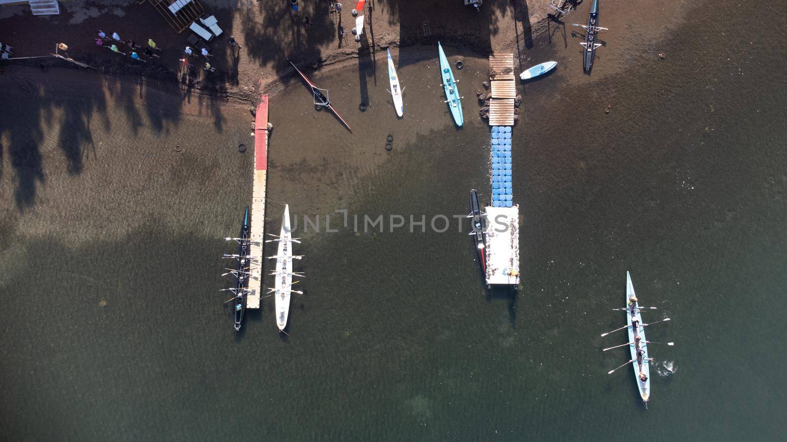 rowing team paddles on the tranquil sea. High quality photo