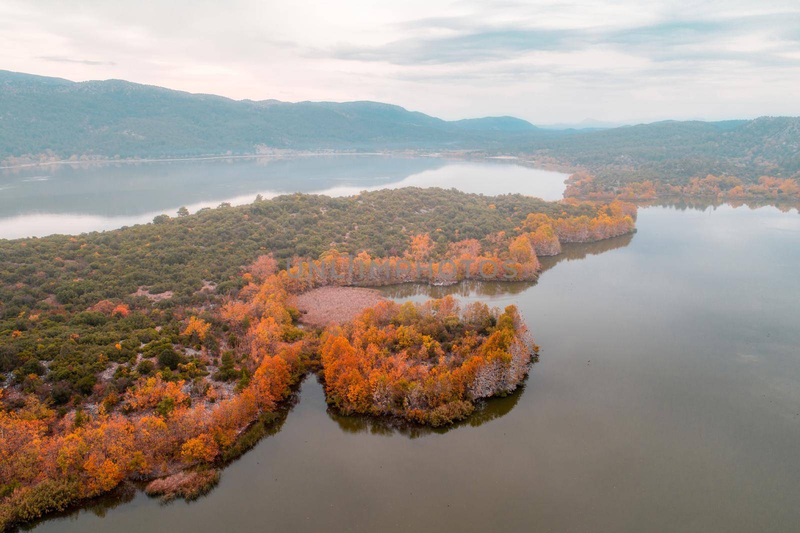 Kovada Lake in Autumn in foggy weather aerial photo shoot with drone