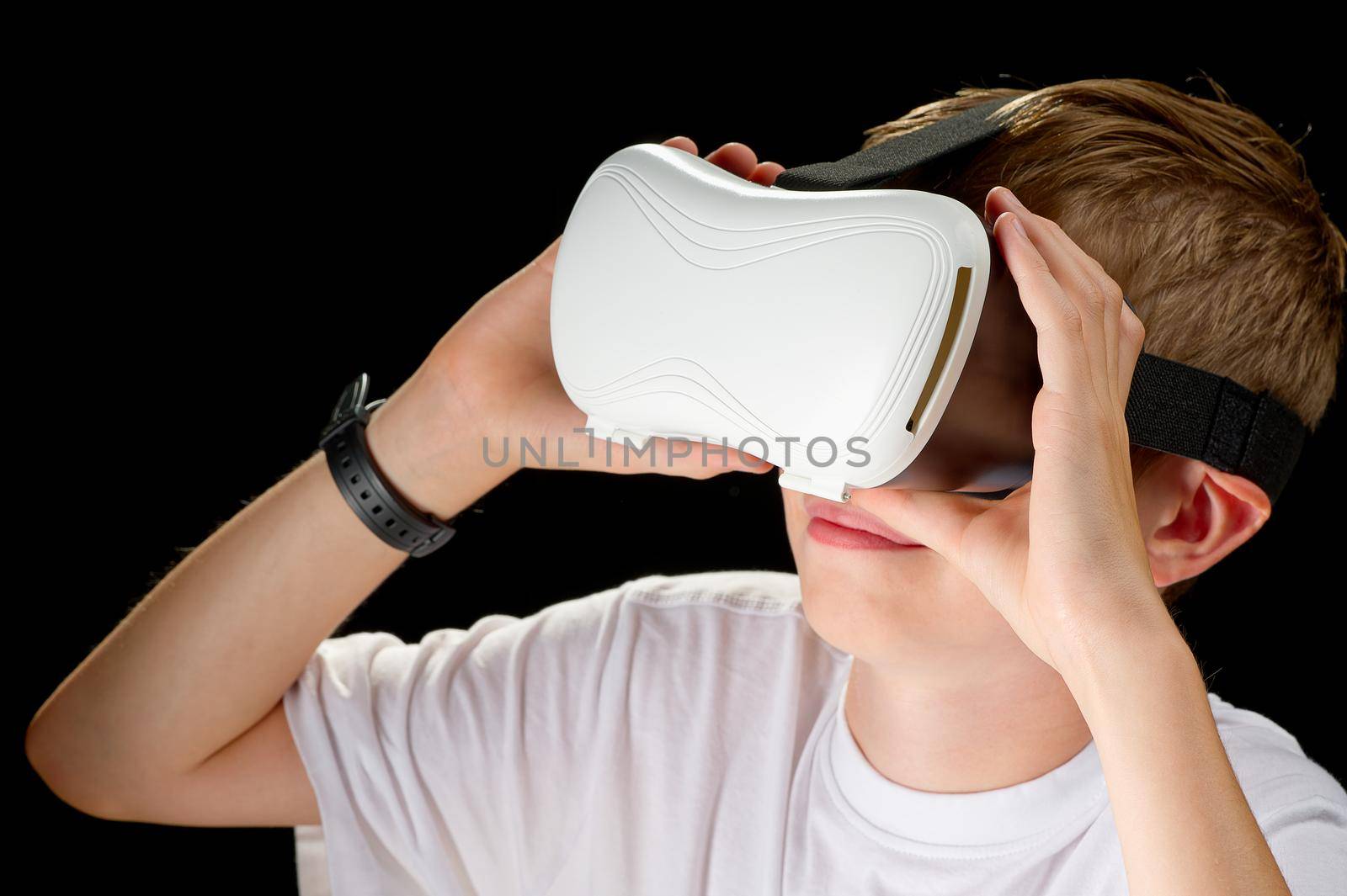 Young man wearing VR goggles. Metaverse technology virtual reality concept. Virtual Reality Device by PhotoTime
