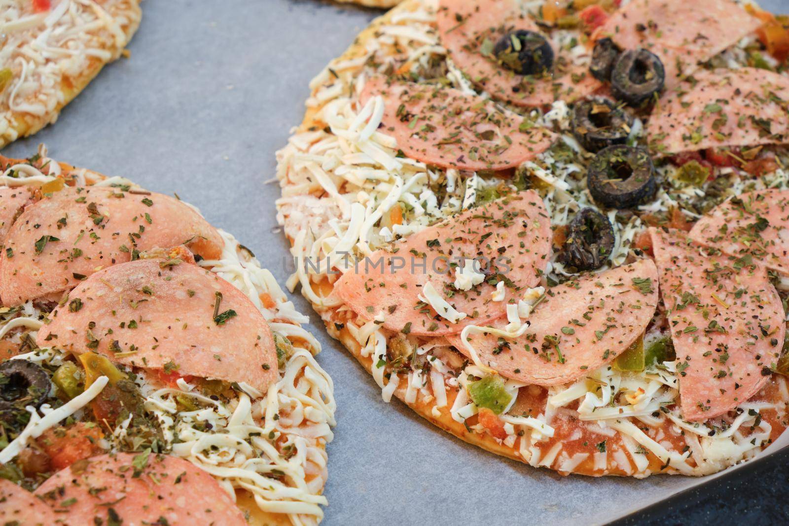 Frozen Italian pizza ready to be baked