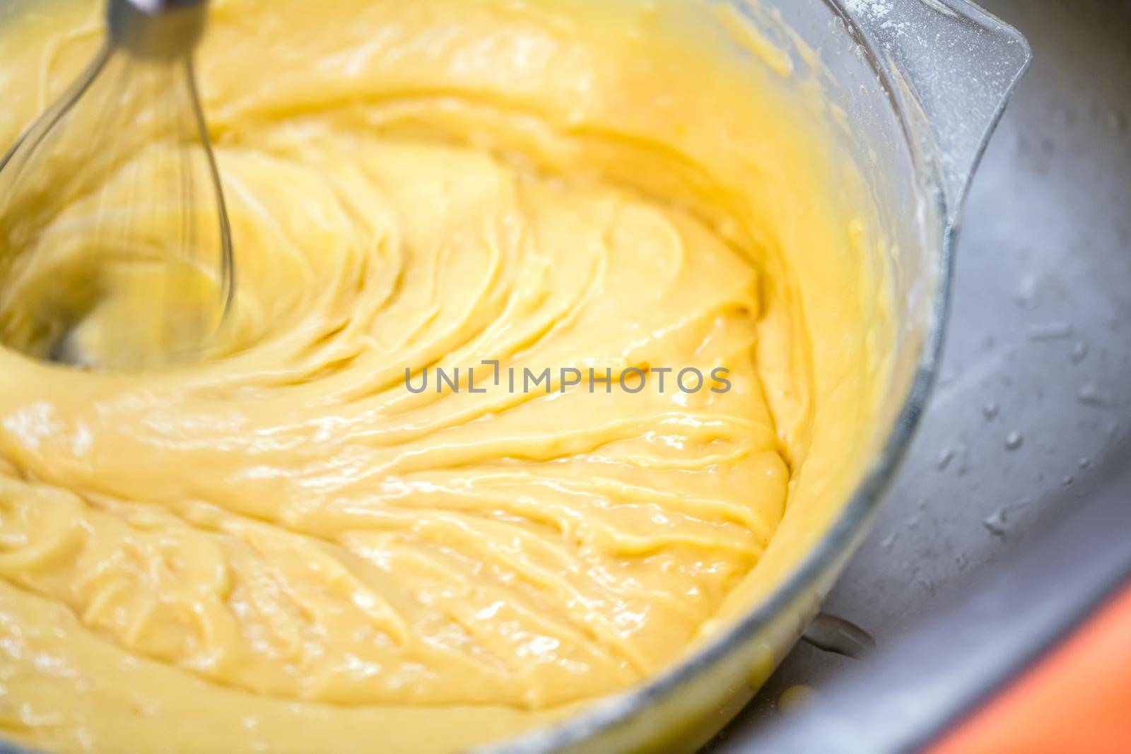 Motion blur photo of mixing homemade delicious cake