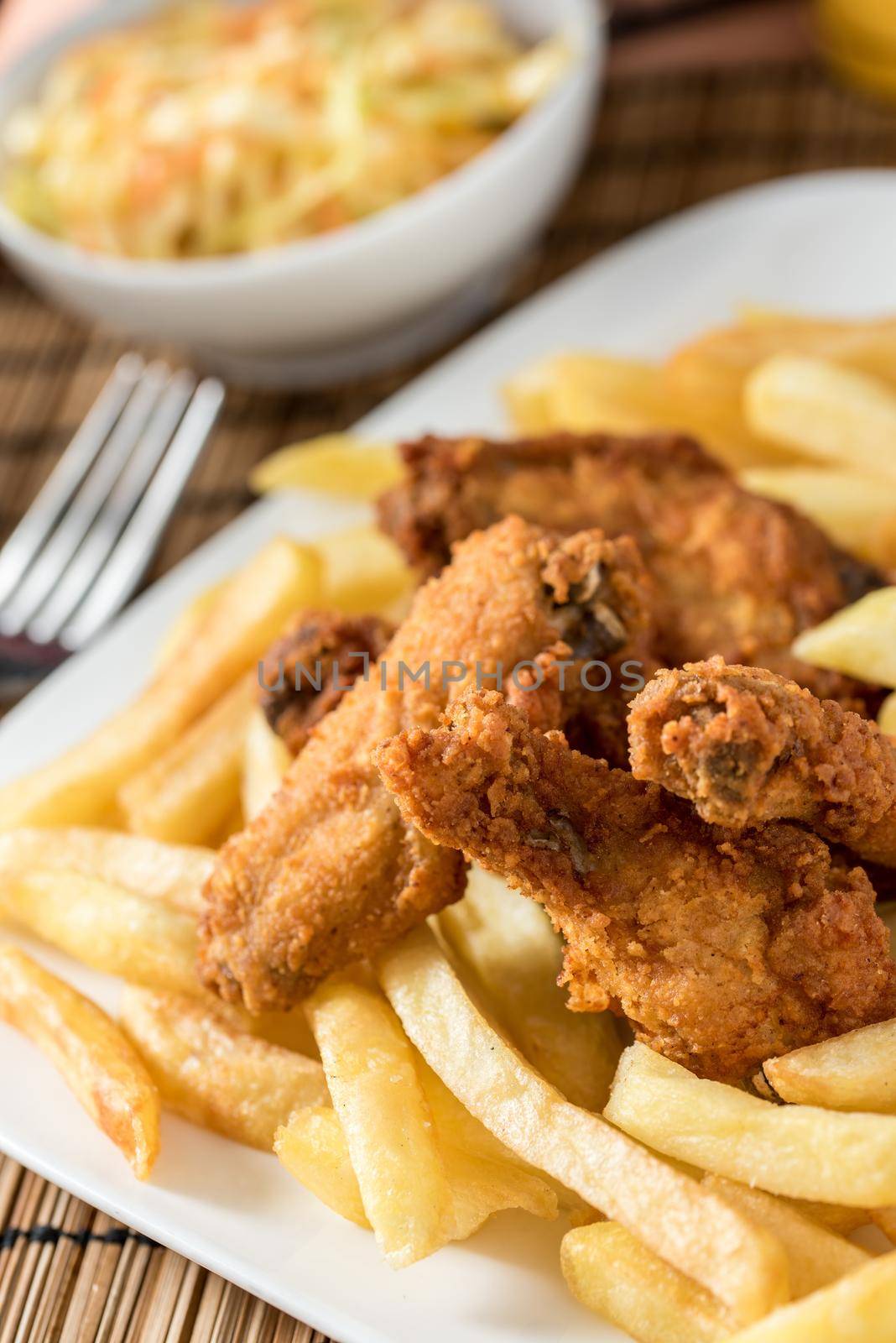 Regional African Food on white plate on wooden background