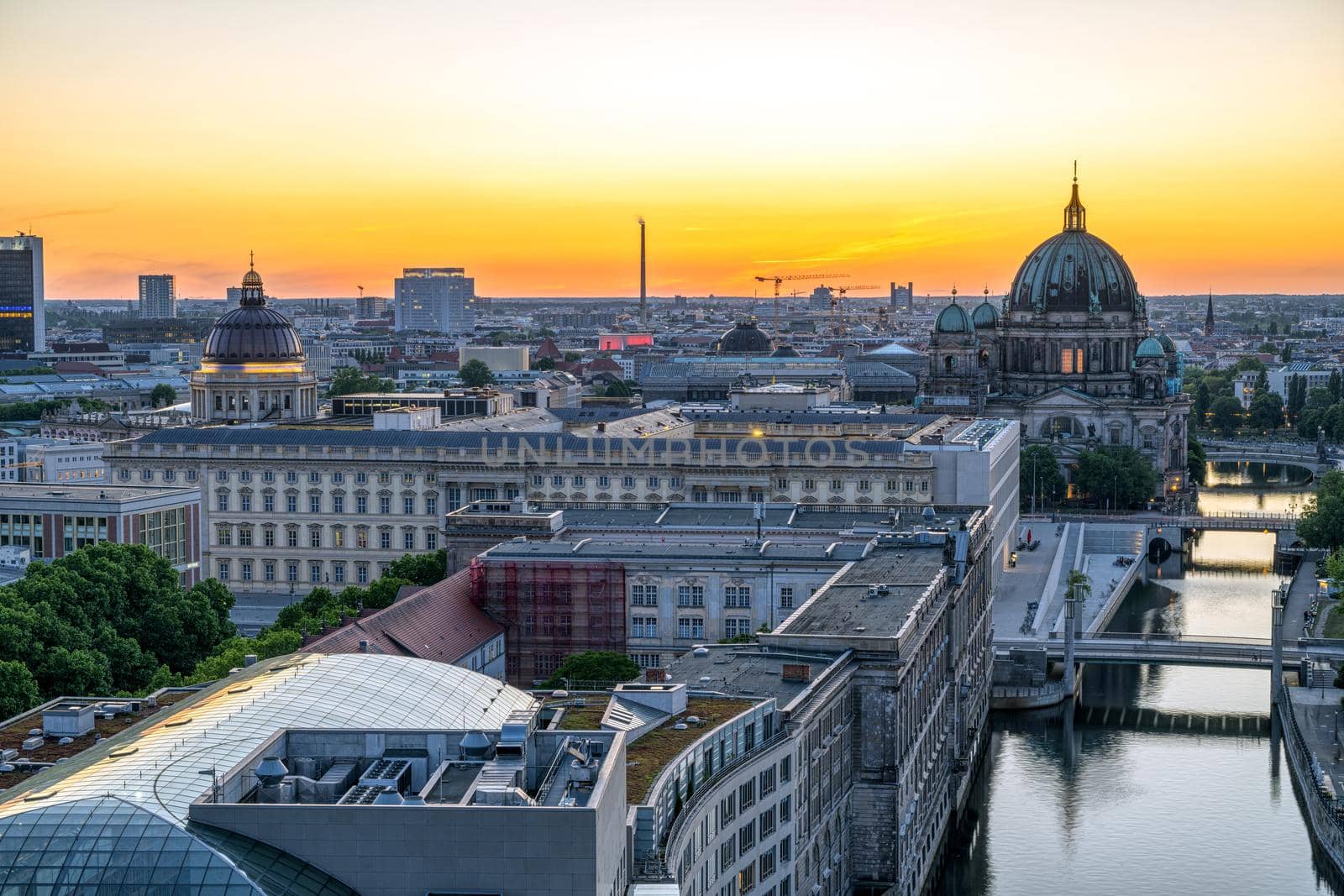 The river Spree and Berlin Mitte after sunset with the cathedral in the back