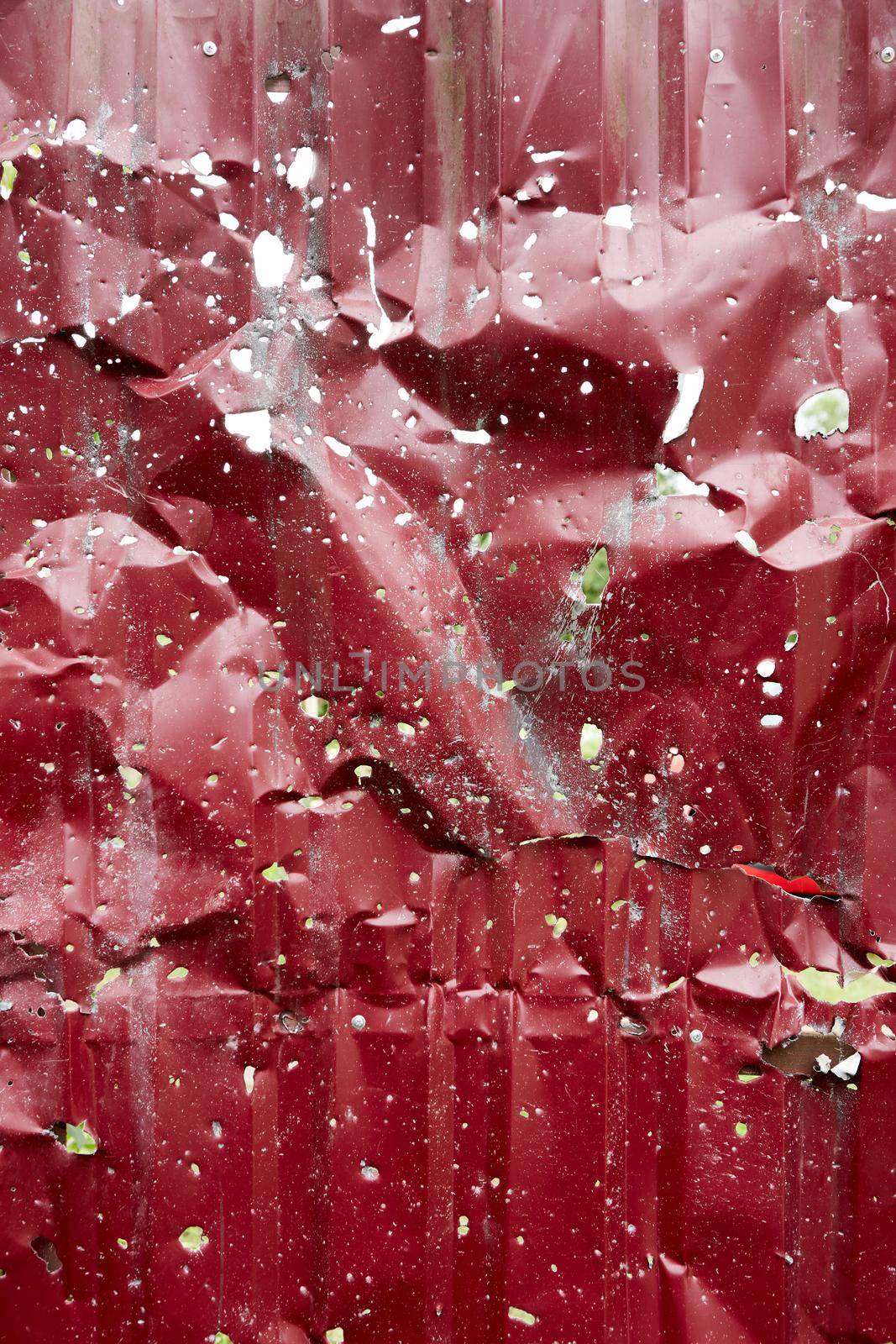 Gate riddled with bullets. Traces of bullets and fragments of shells by sarymsakov