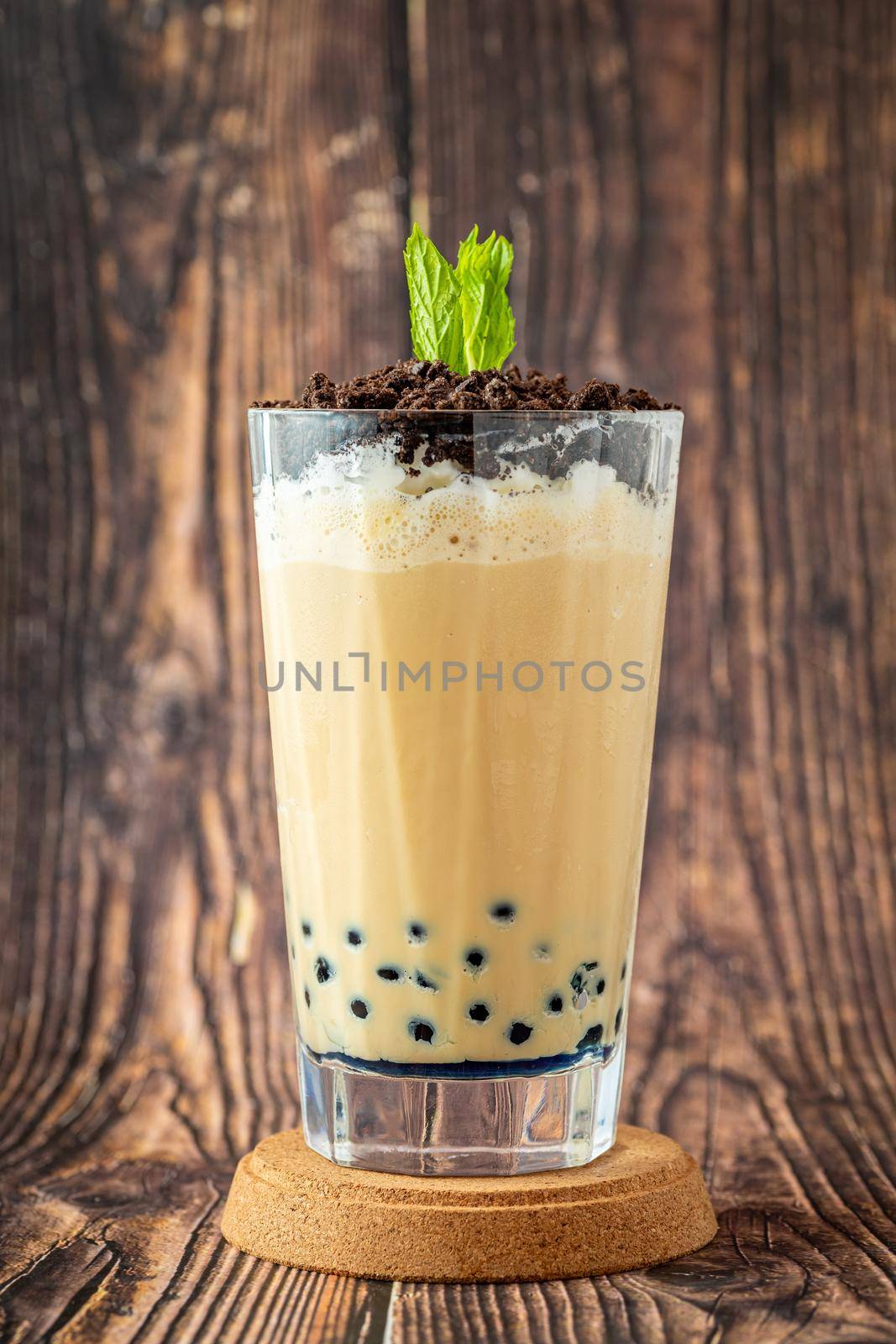 Fruity Bubble Tea in glass cup on wooden background