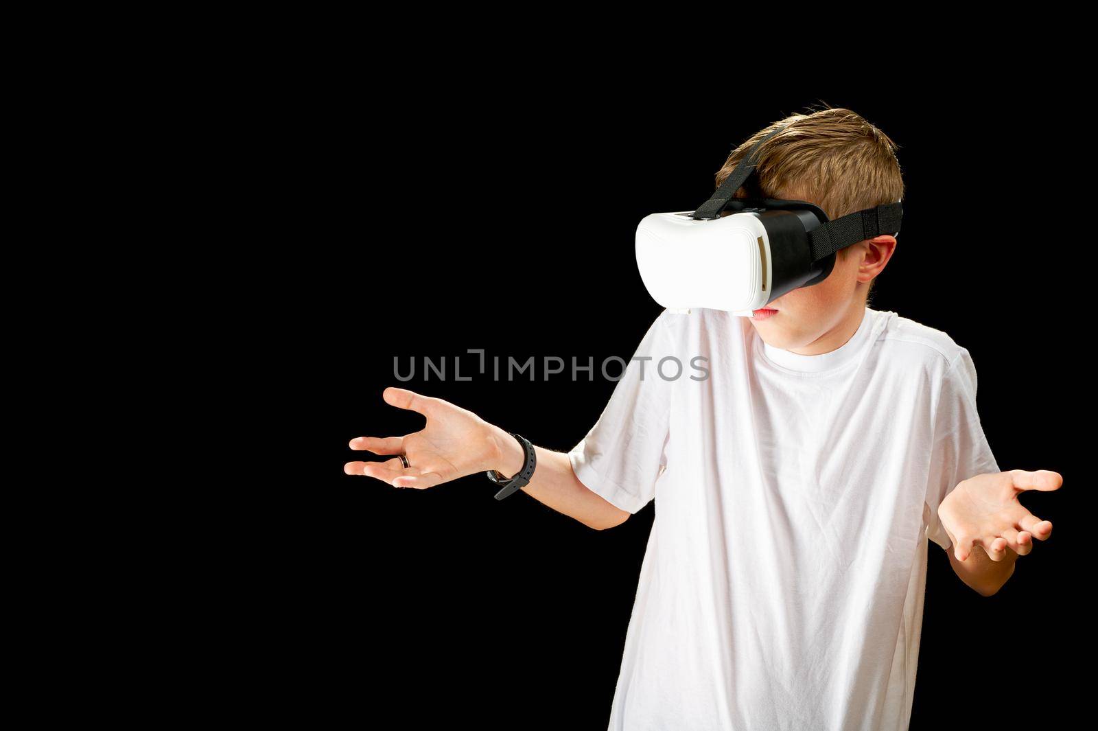 VR Glasses used by a child. Concept of new technology, gaming, education, virtual reality goggles. by PhotoTime