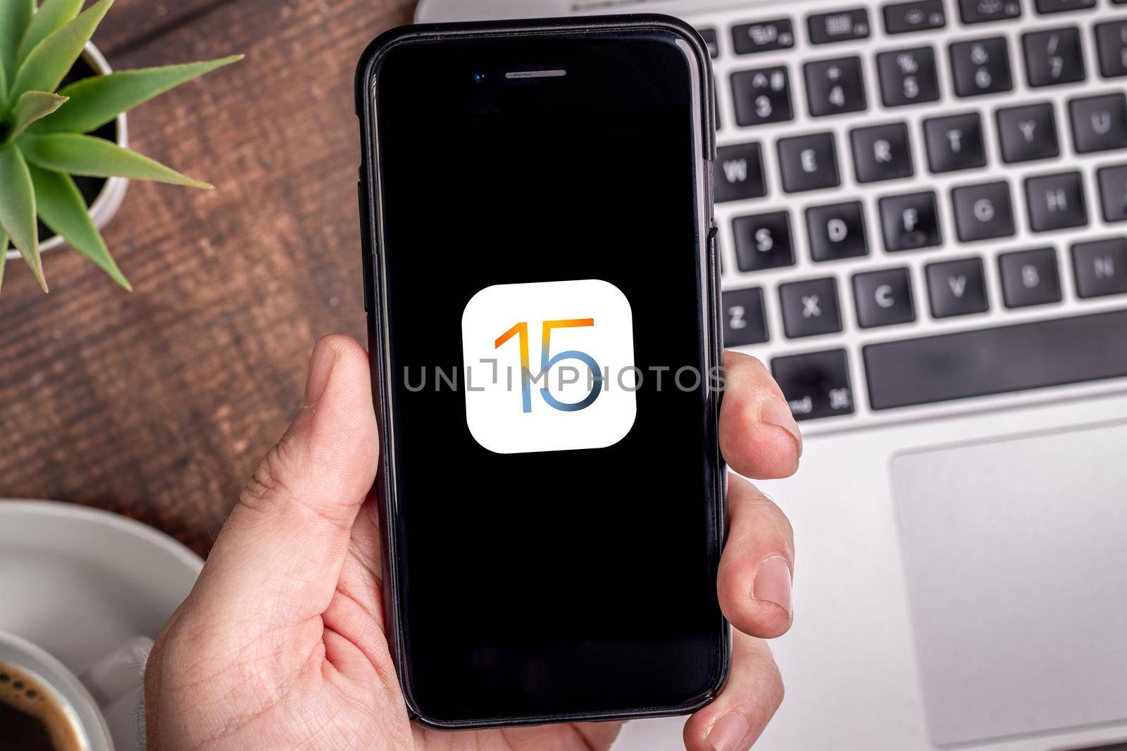 Antalya, TURKEY - August 17, 2021. iPhone with the logo of the new iOS 15, Apple's next operating system for its smarphones to be released.