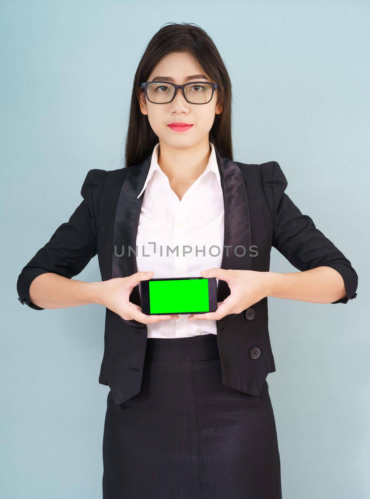 Women holding smartphone mock up green screen  by stoonn