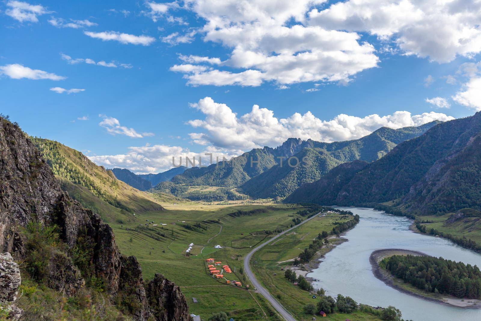 Colorful view of the mountains and the Katun River, with an island in the Altai Mountains, Siberia, Russia. View from the observation deck in the mountains. The concept of recreation and tourism