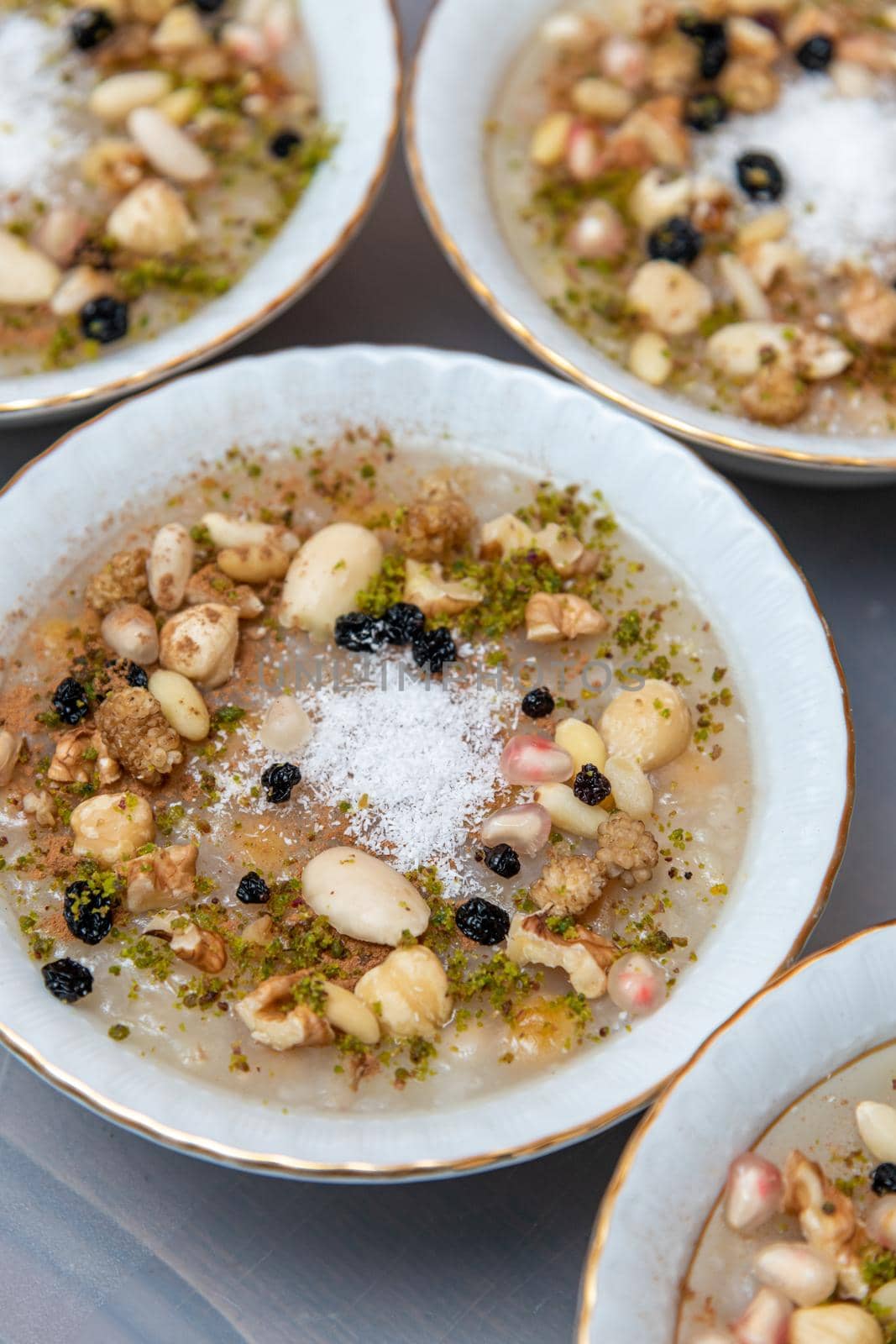 Traditional Turkish Dessert is Asure "Noah's Pudding" on wooden background