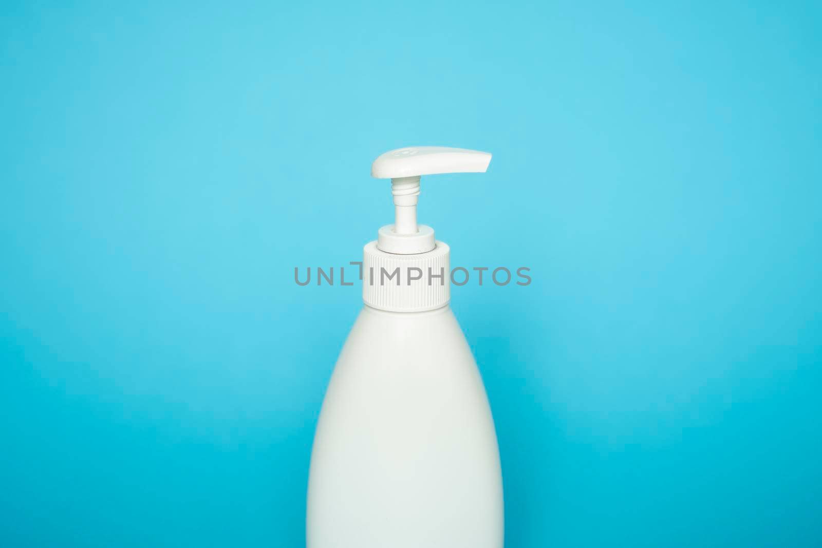 Liquid container for gel, lotion, cream, shampoo, bath foam on blue background. Cosmetic plastic bottle with black dispenser pump. by vovsht