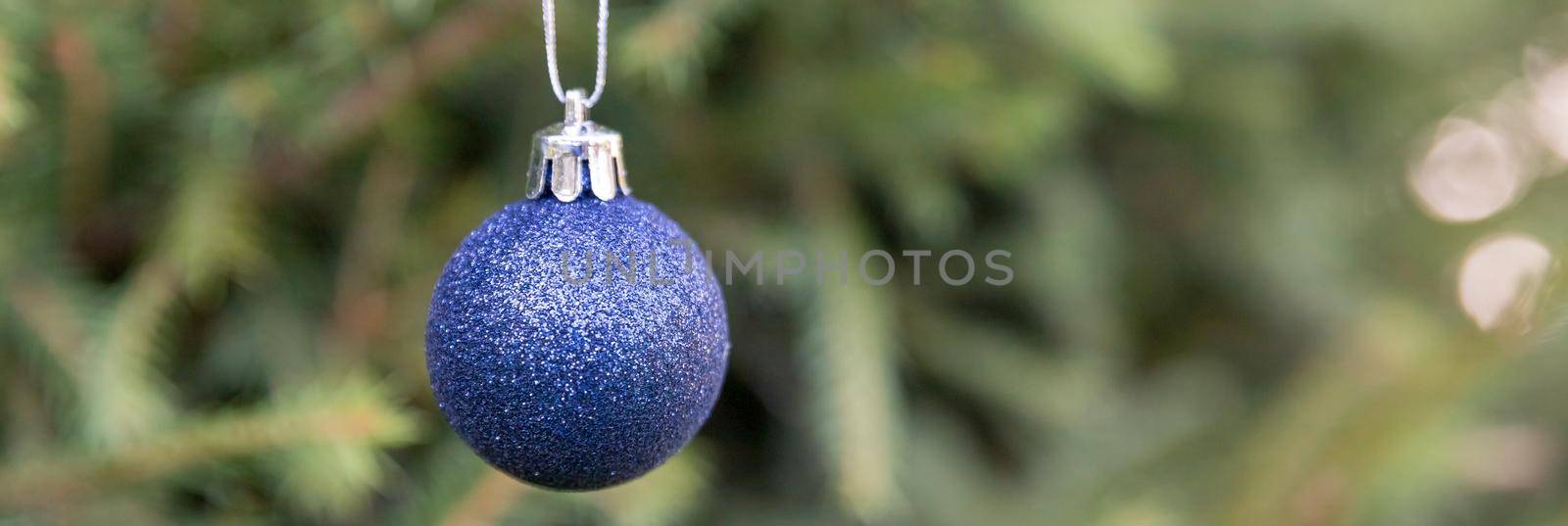 Festive christmas balls at border with space for design. Beautiful green fir tree branches decor