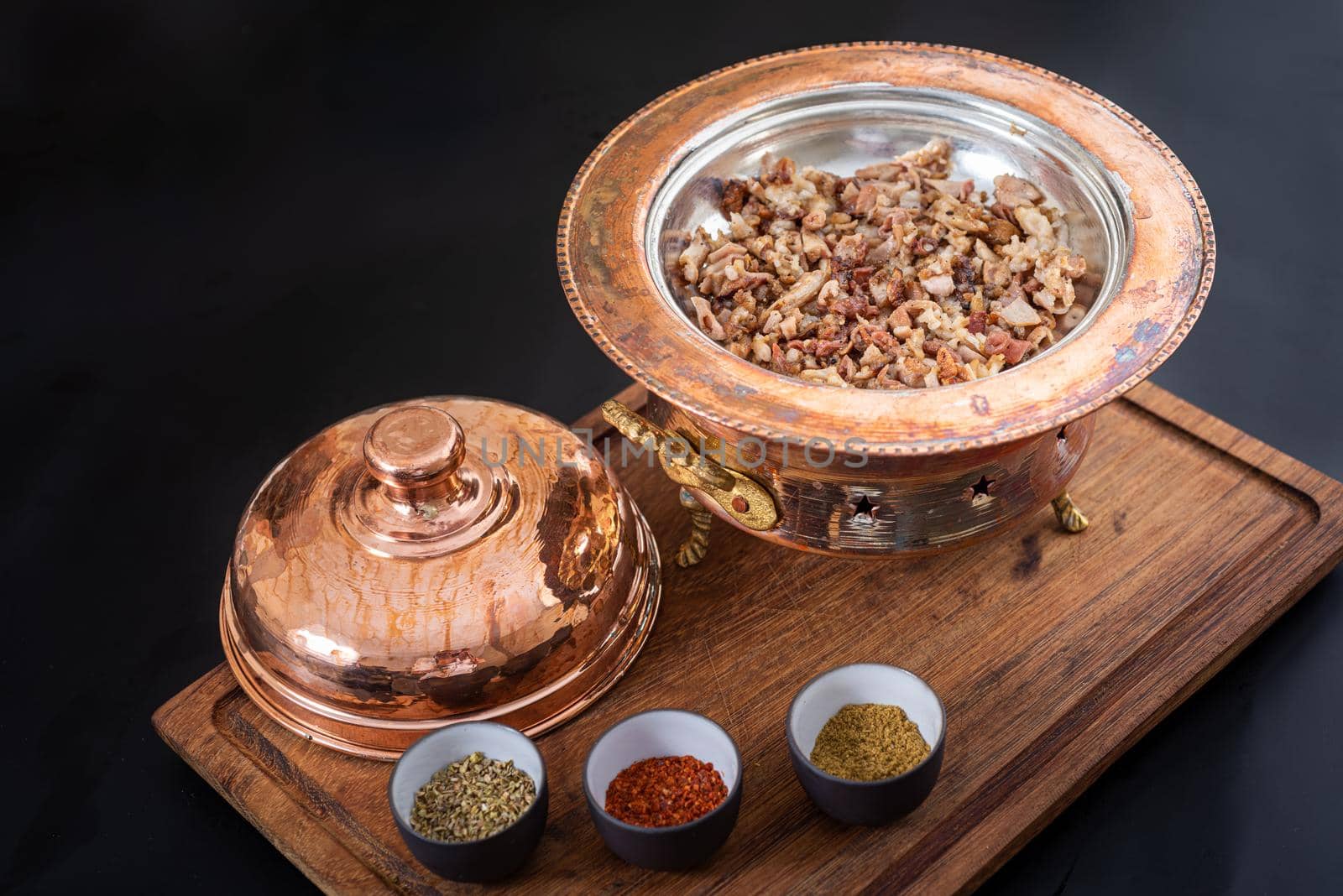 Spicy minced lamb kokorec in a copper skillet. by Sonat